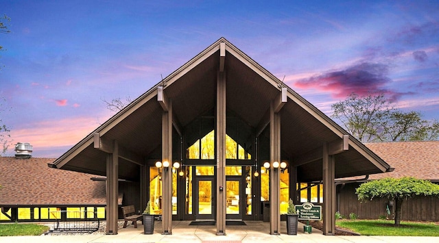 back house at dusk with french doors