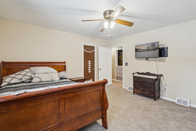 bedroom with ceiling fan and light colored carpet