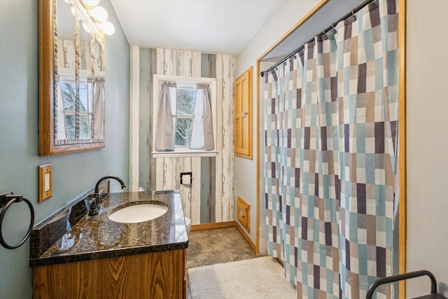 bathroom with vanity and curtained shower