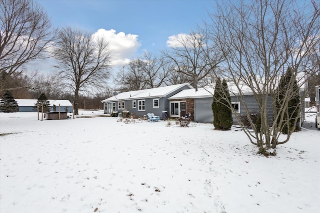 view of snow covered house