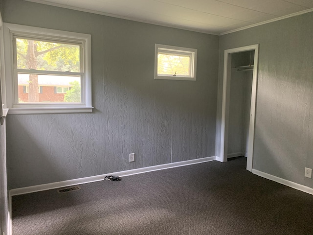 unfurnished room featuring ornamental molding