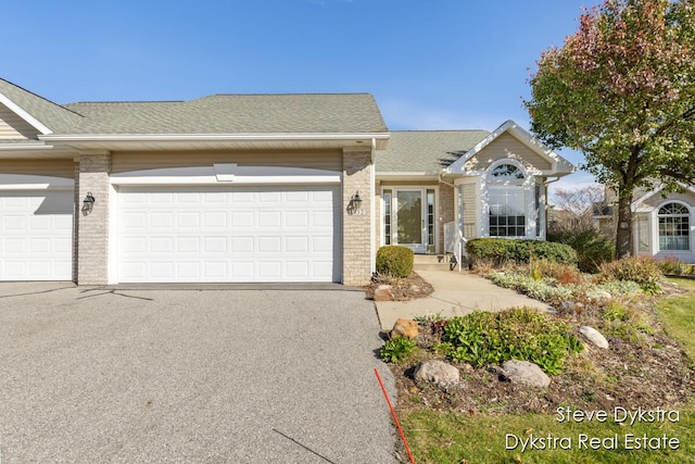 single story home featuring a garage