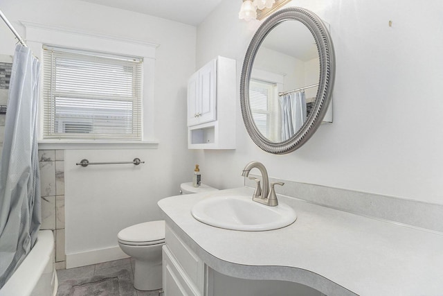 full bathroom with vanity, toilet, and shower / tub combo