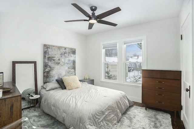 bedroom with light hardwood / wood-style floors and ceiling fan