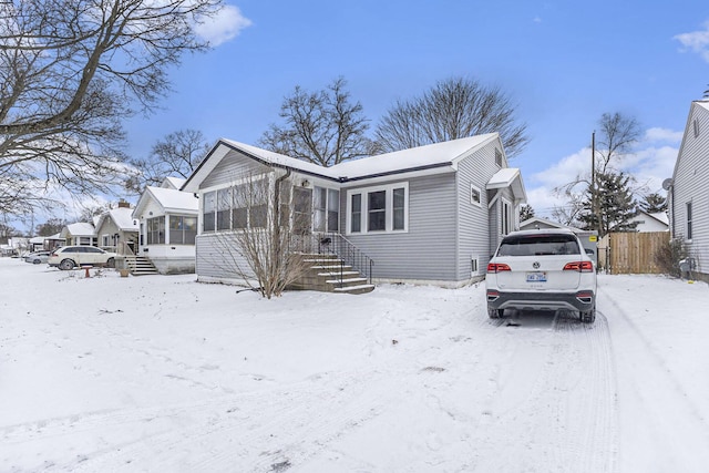 view of front of home featuring a sunroom