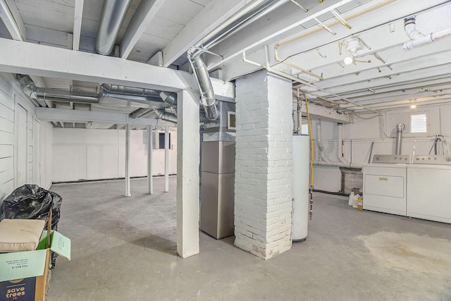 basement featuring washer and clothes dryer and gas water heater