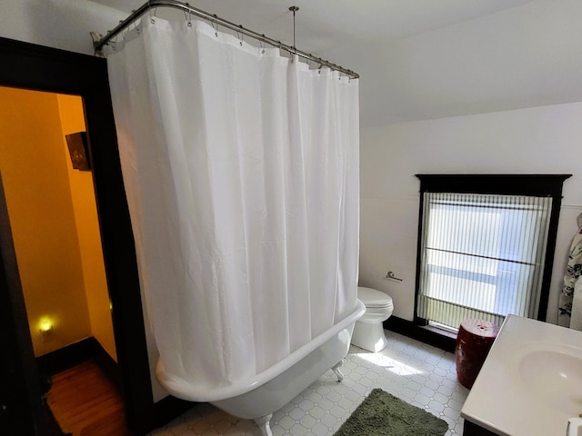 bathroom featuring vanity and toilet