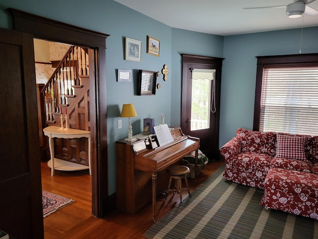 misc room with ceiling fan and dark hardwood / wood-style flooring