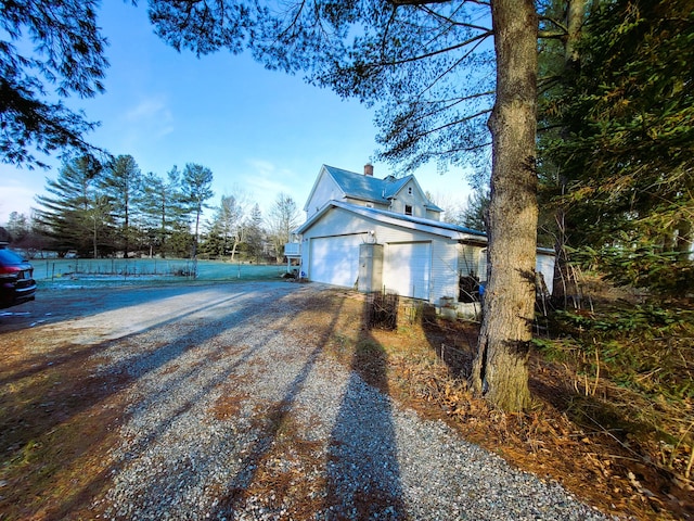 view of side of home featuring a garage