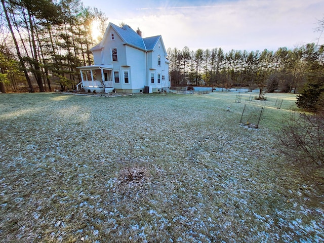 view of yard with covered porch