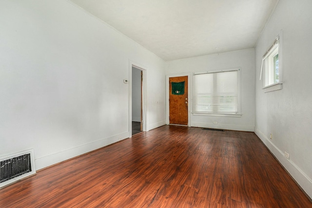 spare room with dark hardwood / wood-style flooring