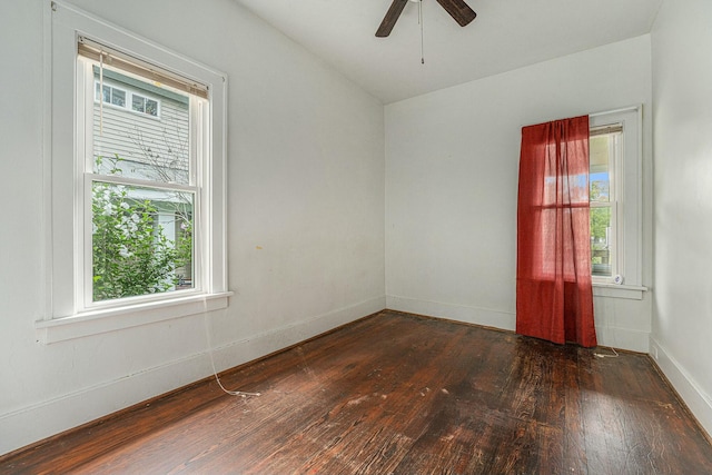 unfurnished room with ceiling fan and dark hardwood / wood-style floors