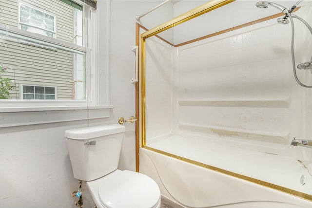 bathroom featuring shower / bath combination and toilet