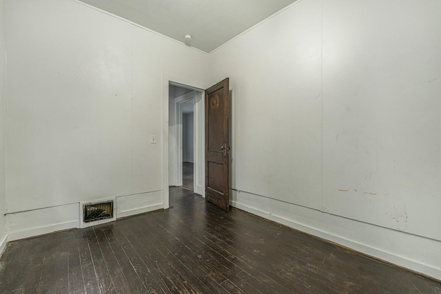 unfurnished room featuring dark hardwood / wood-style flooring