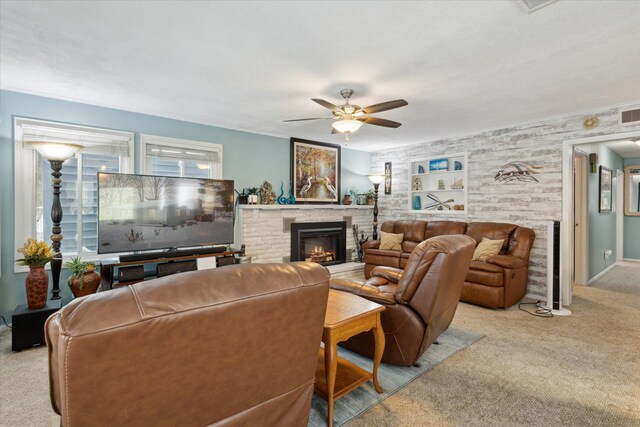 living room featuring a fireplace, light colored carpet, built in features, and ceiling fan