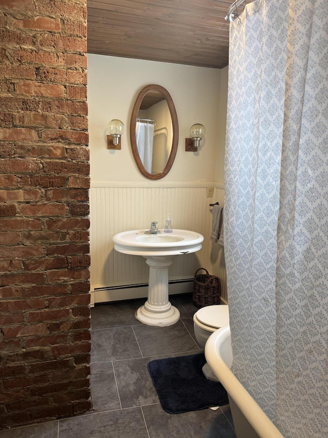 bathroom featuring tile patterned flooring, wood ceiling, a baseboard radiator, and toilet