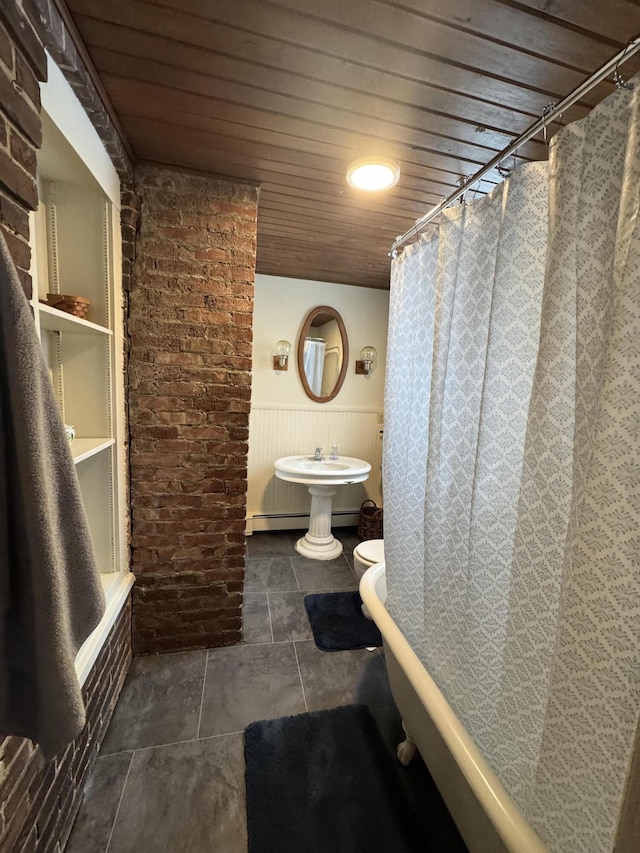 bathroom featuring shower / bath combo with shower curtain, wood ceiling, a baseboard radiator, and toilet