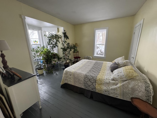 bedroom featuring dark hardwood / wood-style flooring