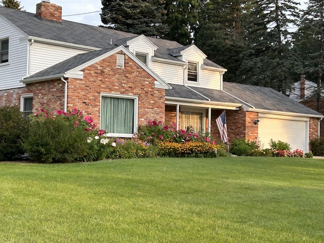 view of front facade with a garage and a front lawn