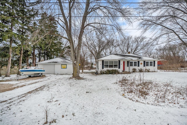 view of front of house featuring an outdoor structure and a garage