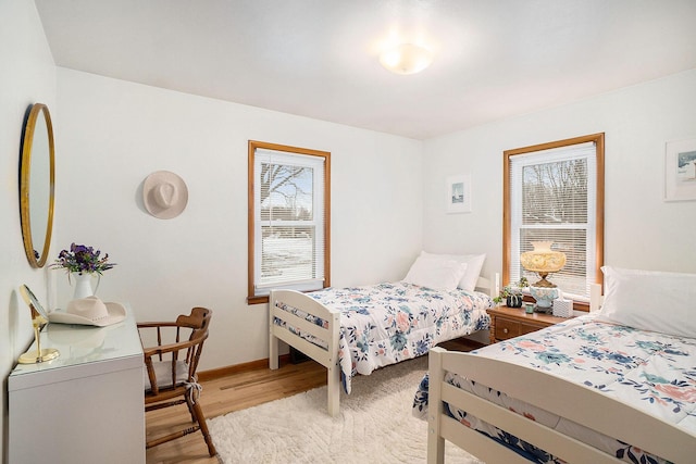 bedroom with light hardwood / wood-style floors