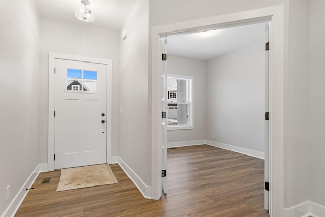 foyer with dark hardwood / wood-style floors