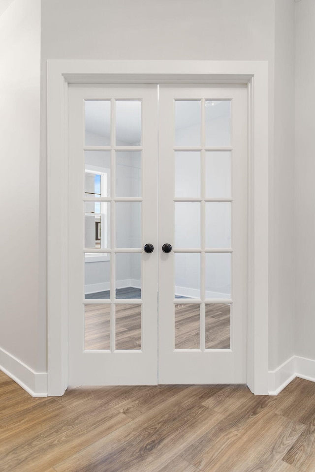 doorway to outside with hardwood / wood-style floors and french doors