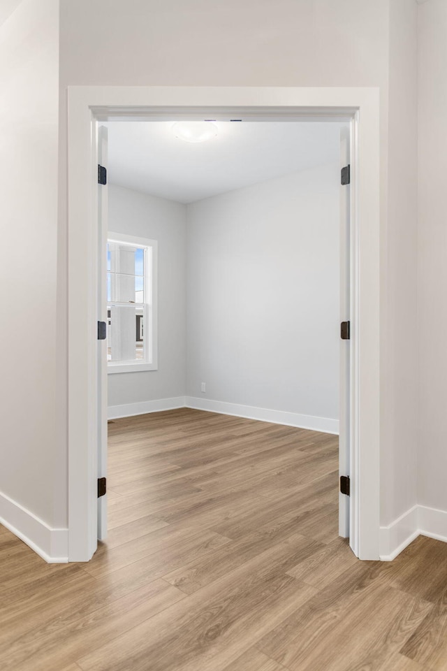 empty room with light wood-type flooring