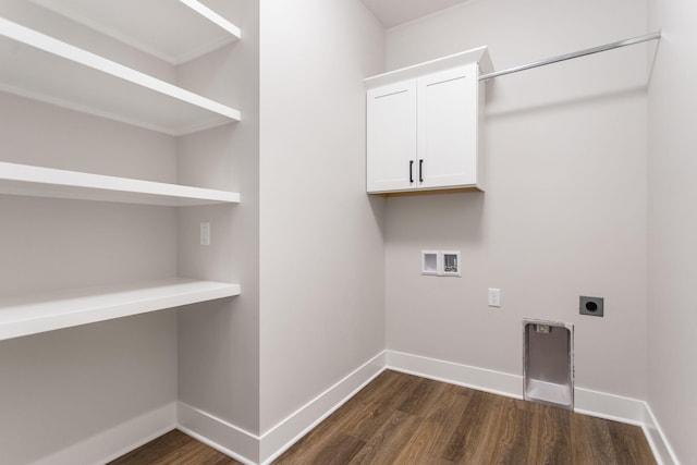 laundry area featuring hookup for an electric dryer, washer hookup, dark hardwood / wood-style flooring, and cabinets