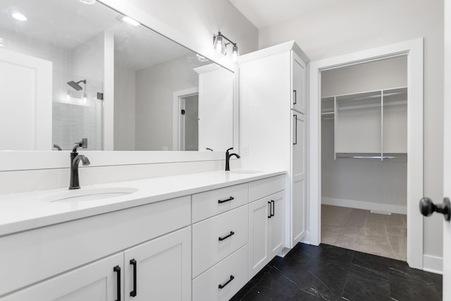 bathroom with a shower and vanity