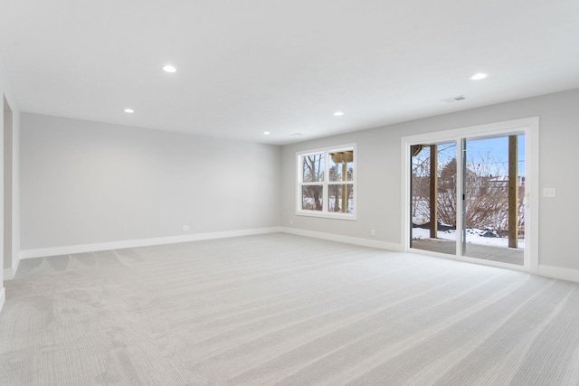 spare room with light colored carpet