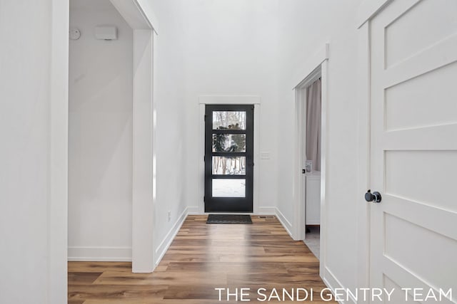 16500 Haven Woods Ct, West Olive, MI 49460 - foyer entrance featuring wood finished floors and baseboards