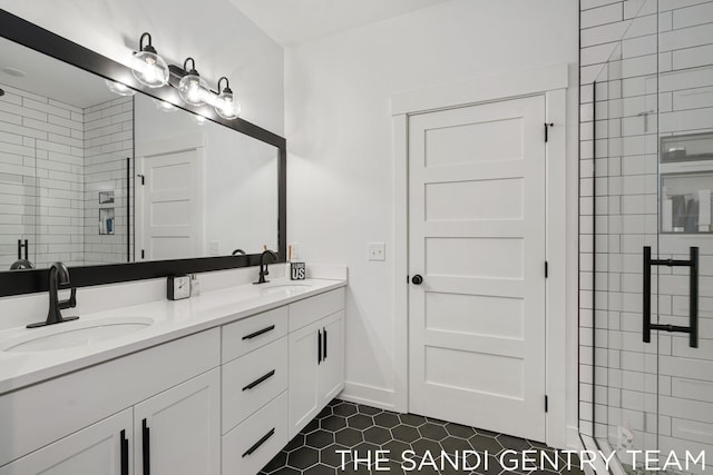 bathroom featuring tile patterned floors, vanity, and walk in shower