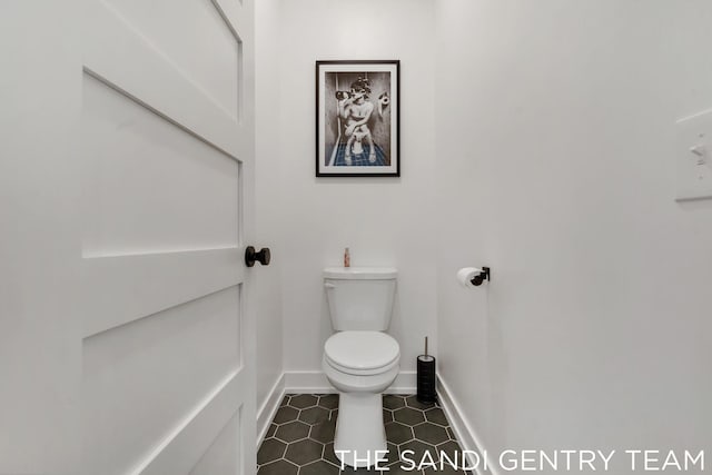 bathroom with tile patterned floors and toilet