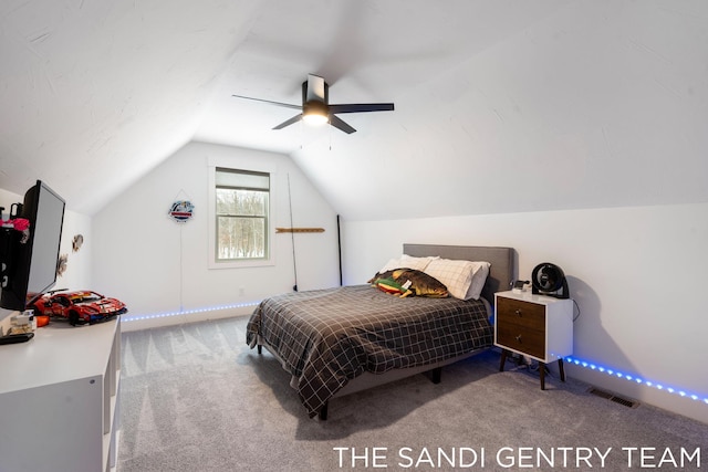 carpeted bedroom featuring ceiling fan and vaulted ceiling