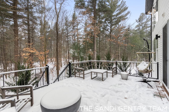 view of snow covered deck