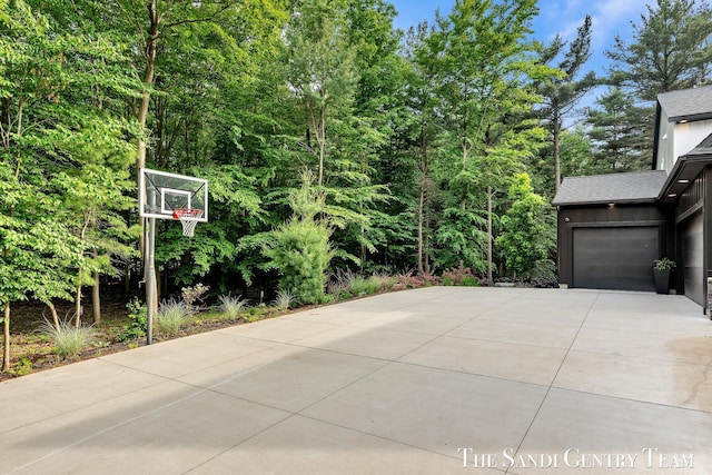 16500 Haven Woods Ct, West Olive, MI 49460 - view of patio / terrace with concrete driveway and an attached garage