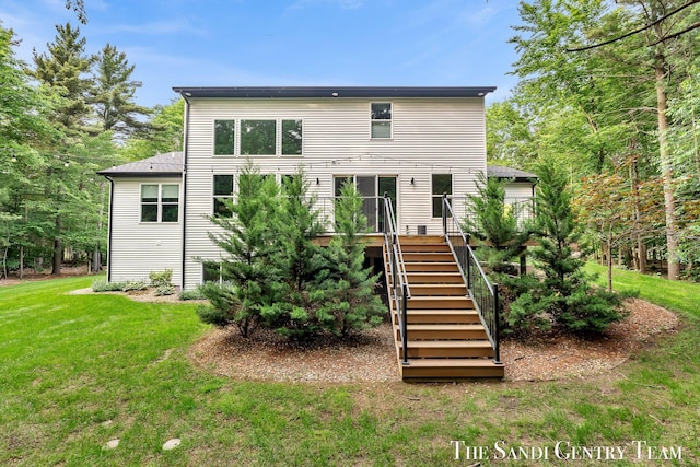 16500 Haven Woods Ct, West Olive, MI 49460 - rear view of house featuring a yard, stairs, and a wooden deck