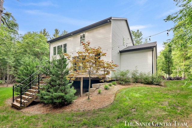 16500 Haven Woods Ct, West Olive, MI 49460 - view of side of property featuring stairway, a lawn, and a wooden deck