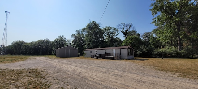 exterior space with a shed