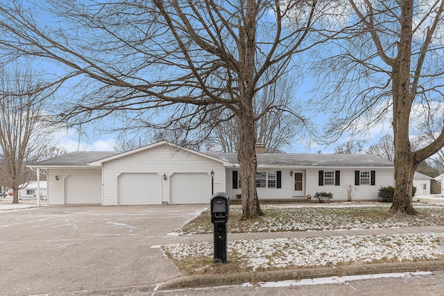 ranch-style house featuring a garage