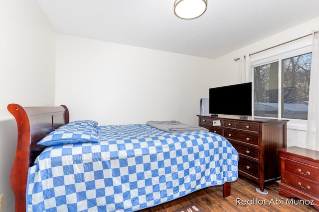 bedroom with hardwood / wood-style floors