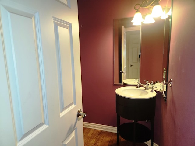 bathroom featuring hardwood / wood-style floors and vanity