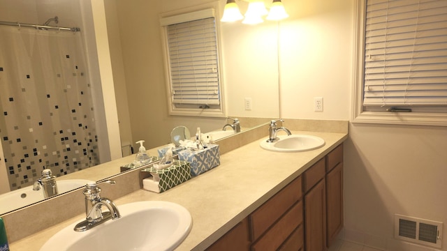 bathroom with tile patterned floors, vanity, and a shower with shower curtain