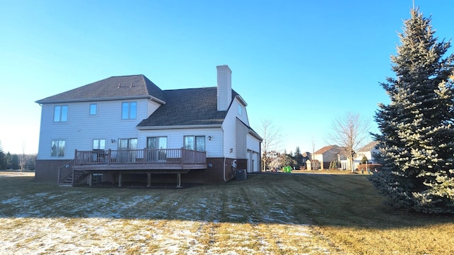 back of property featuring a lawn and a deck