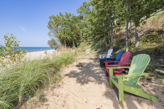 exterior space featuring a water view and a view of the beach