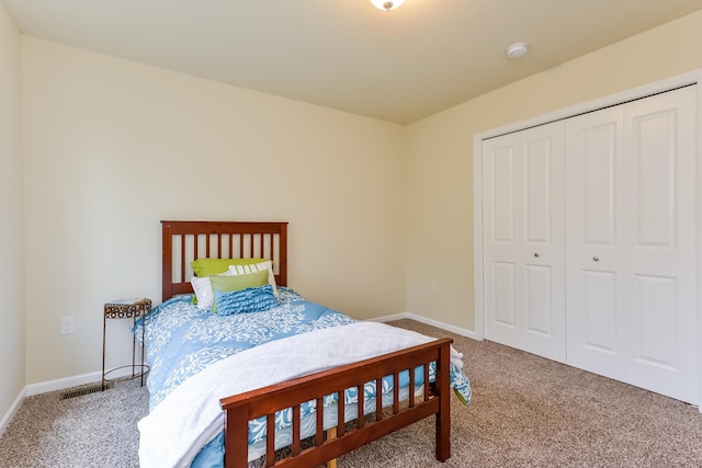 carpeted bedroom featuring a closet