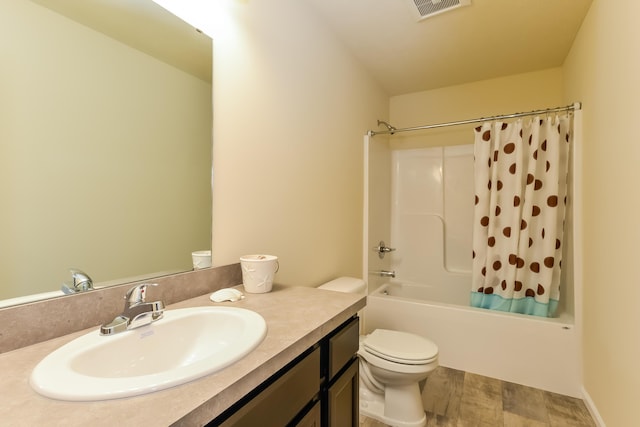 full bathroom featuring toilet, vanity, and shower / bathtub combination with curtain