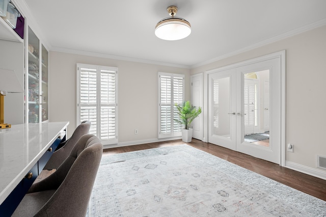 unfurnished office with french doors, visible vents, ornamental molding, wood finished floors, and baseboards