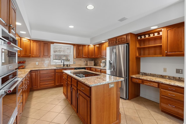 kitchen with a center island, black electric stovetop, open shelves, built in study area, and stainless steel fridge with ice dispenser